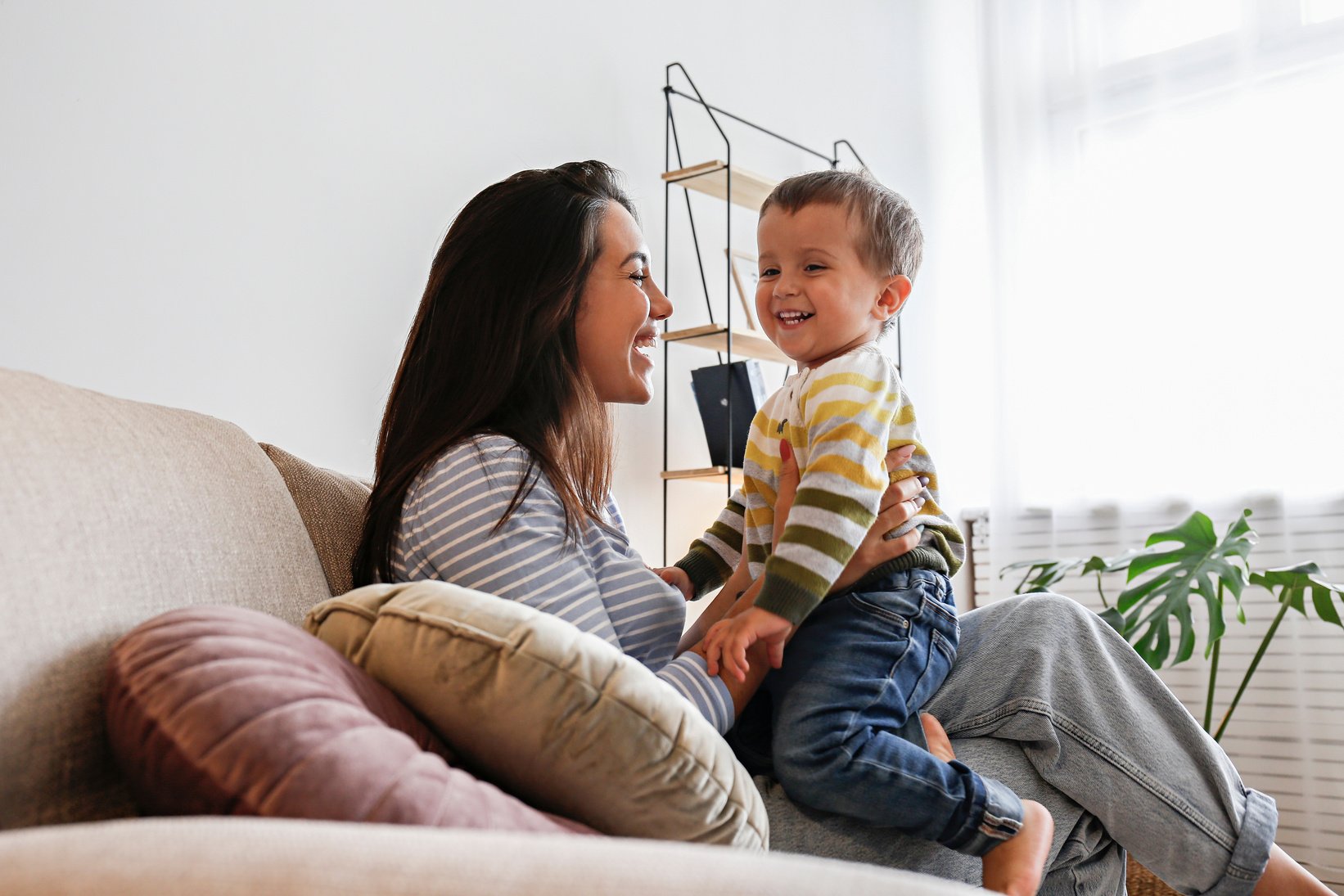 Toddler at home with his mom.