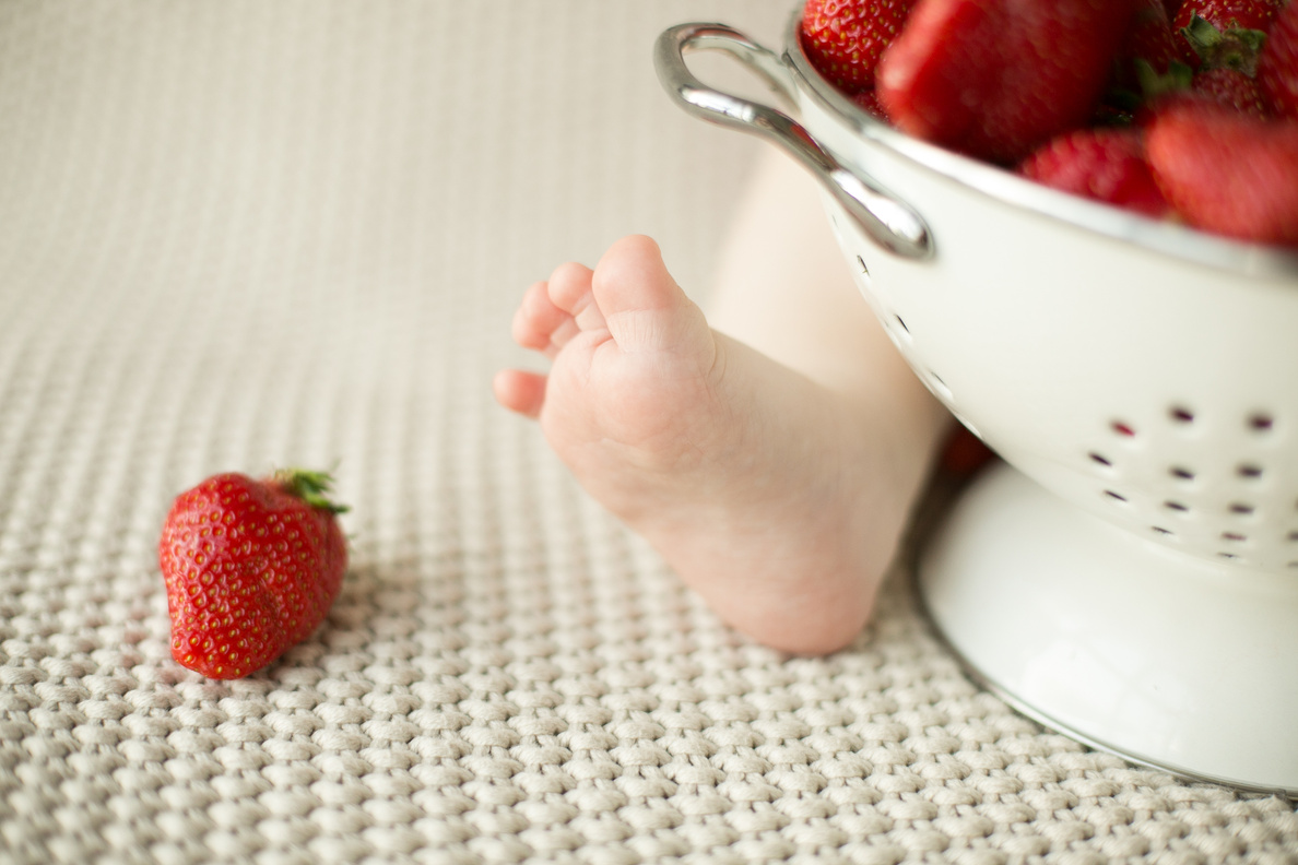 Baby eats strawberries